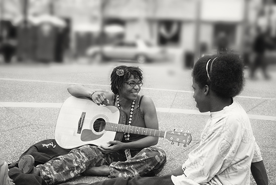 One of the frist sunny days in spring brought these young women into Market Square in Downtown Pittsburgh. The next day a very similar picture of the guitarist appeared in the Pittsburgh Post-Gazette, which was still publishing daily back then.