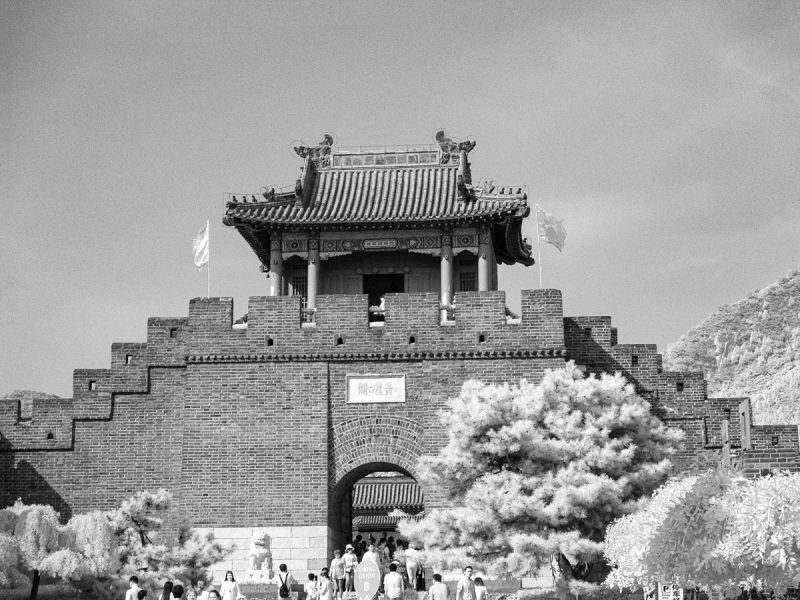 Black and white infrared image of a pagoda style guard tower at an entrance to the Great Wall