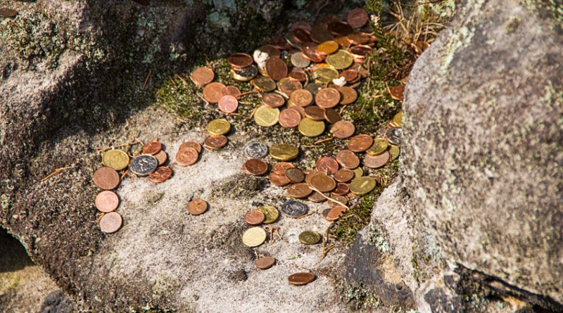 Coins deposited in a mountain grotto for good luck.
