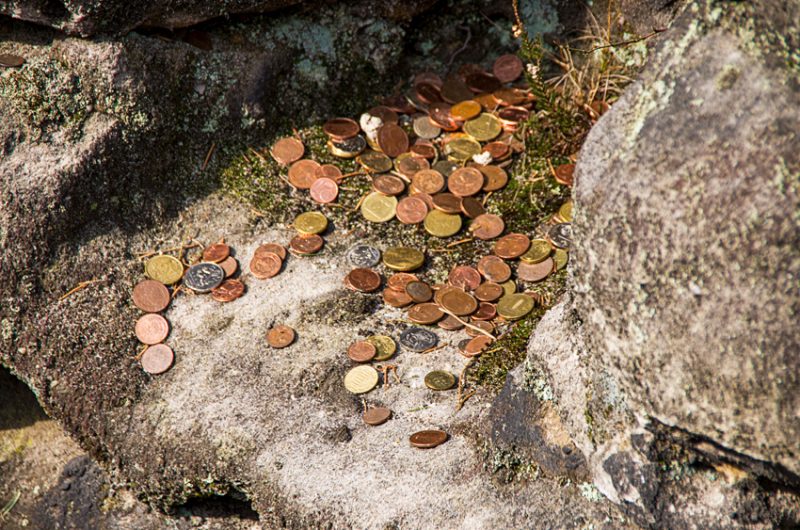 Coins deposited in a mountain grotto for good luck.