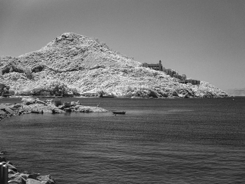 Hong Kong Structure on a Hillside with a Row Boat